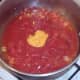 Mustard is added to spicy tomato sauce