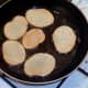 Potatoes are turned to fry on second sides
