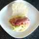 Bacon strips are laid on mashed egg