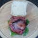 Bacon rashers are laid on lettuce and tomato