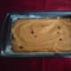 Pour the batter into a greased 9 x 5 inch loaf pan.