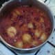 Simmering potato and red kidney bean vegetarian curry