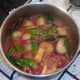 Vegetables are simmered in curry sauce until re-heated.