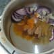 Sauteing onion and garlic with biryani spices