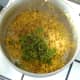 Coriander (cilantro) and black pepper are added to turmeric brown rice