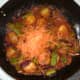 Carrot is grated in to jalfrezi at last minute