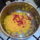 Chilli is added to drained rice.