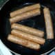 Vegan sausages are gently shallow fried in oil