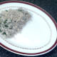 Spinach and garlic rice is arranged on serving plate