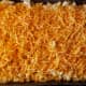 Put noodles in a baking pan. Sprinkle extra shredded cheese on top. Bake for 25 minutes.