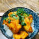 Serve the orange chicken with steamed white rice. Garnish with chopped cilantro and sesame seeds. Enjoy! 