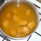 Potatoes are boiled in turmeric water