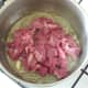 Diced lamb is added to sauteed onion