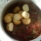Boiled and cooled potatoes are added to curry sauce