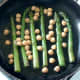 Chickpeas are added to pan with asparagus