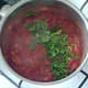 Coriander/cilantro is added to tomato sauce