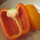Half of a red and orange bell pepper ready to be chopped