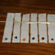 Six numbered strips of paper towelling with the marker colours noted. Tape the strips to a dowel. 1. Grey; 2. Dark Green; 3. Orange; 4. Dark purple; 5. Brown; 6. Black