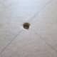3. Enlarge this hole with a compass or sharp pencil and make sure that the stick fits through hole.