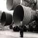 Von Braun in front of the Saturn V rocket engines the most powerful ever built a product of his creation they would land man on the moon.