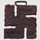In 1925, one of the world's most famous companies employed the swastika in a piece of good luck merchandise. Coca-Cola made this little 'fob' for a watch chain