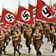 A Nuremburg rally. By 1930 when this photo was taken, the swastika flag was everywhere in Nazi news reels - it had became a symbol for everything they stood for. The notoriety could only grow