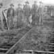 Men working on laying tracks for the KCS railroad..