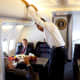 President Barack Obama aboard a C-32A, which gave it the radio call sign &quot;Air Force One&quot;.