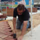 Eric Standridge laying brick
