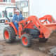 Ripping out planters and other fixtures inside the Poteau Pocket Park (Town Square)
