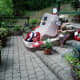 The memorial surrounded with the plants Tony has bought and tended.
