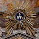 IHS monogram at the top of the main altar at Ges&ugrave; in Rome, Italy.