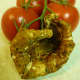 This cup shaped mushroom picked days earlier (in July of 2010) had already hardened and dried. Same campari tomatoes for reference as to size