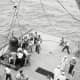 Faith 7 is brought aboard the recovery carrier, the U.S.S. Kearsarge. Photo courtesy of NASA.