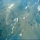 Photo of earth taken from orbit by Gordon Cooper aboard Faith 7. Photo courtesy of NASA.
