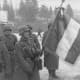 French soldiers of the German &quot;Legion des Voluntaires&quot; unit holding a French flag in Russia, 1941.