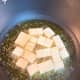 Fry the tofu, flipping each piece every 2 minutes. Cook until the pieces turn golden brown.