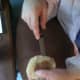 The wrong way to cut a bagel or muffin. Cutting something this way is asking for a tendon injury.