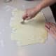 Continue across the rolled-out dough using a careful roll with the pie crust roller.