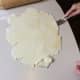 Run a long bladed spatula under the rolled out dough to lift any parts that are sticking to the table.