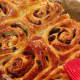 Brush the warm cinnamon rolls with honey, apricot jam, or sugar syrup. Let them stand until set.