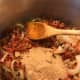 Return the cooked bacon to the pan with the onions, and add the remaining ingredients. Brown sugar, apple cider vinegar and strong coffee. Bring to a simmer, and cook between 2-3 hours, stirring occasionally.