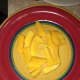 Slice the mangos into small pieces.