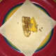 Place one slice of banana and mango on the spring roll wrapper. Make sure you are using a dry surface so that the wrapper won't stick.