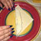 Begin to roll. Halfway through, tuck in each end and then finish rolling. At the end take a small amount of water and seal the edge.