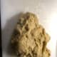 The dough is not sticky, but tacky. You also don't want to add so much flour that it becomes smooth.