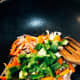 Add the carrots and green bell pepper into the mixture.