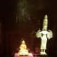two Buddha statuettes. One depicts Knowledge and Power, the other is wisdom personified.