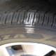 The inner rear tire shows wear similar to the front. If it were not overinflated, more of the tread would contact the road.