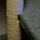 String wrapped around the tube, even around the cutout slots.